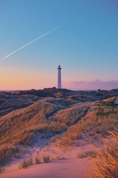 Lighthouse in the dunes of the danish north sea coast. High quality photo