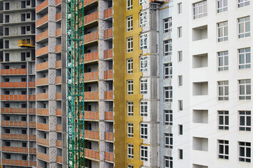 Fototapeta na wymiar Modern concrete structure, building under construction. Detailed view the process of building new multi-storey house. Concrete and metal construction of new multi-storey building. Abstract background