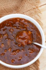 Traditional South African fruit chutney, a popular condiment in a white bowl with copy space