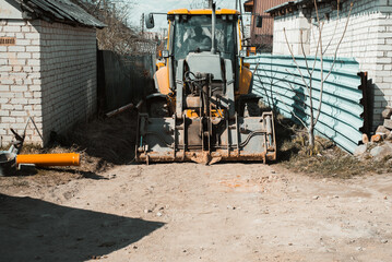 Fototapeta na wymiar Modern tractor on country road, construction work