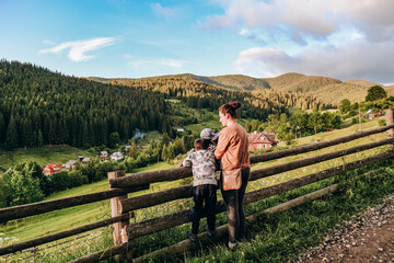 Family vacation in the mountains in summer. Enjoy the sunset in the mountains with the whole family.