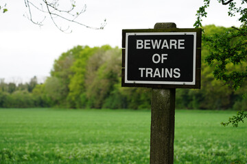 beware of trains sign