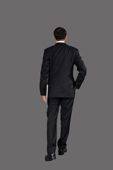 Back view  Portrait of attractive businessman Asian standing against on gray background , clipping path