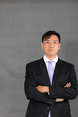 Obraz na płótnie Canvas Portrait of attractive businessman Asian standing against on gray background with copy space and clipping path