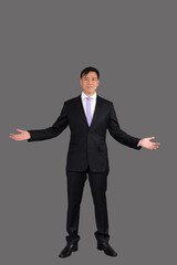 Portrait of attractive businessman Asian standing against on gray background with copy space and clipping path
