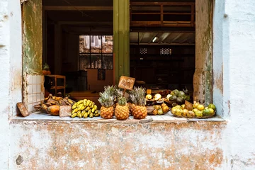 Fotobehang Fruit for sale in a shop window in the old center of Havana, Cuba, North America © jeeweevh