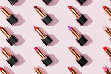 Fototapeta na wymiar Multi-color lipsticks, lip gloss on pink background. Cosmetic products. Makeup accessories. Skin care. Beauty pattern 3d.