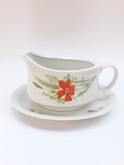 Vintage porcelain saucer cup with poppy flower pattern