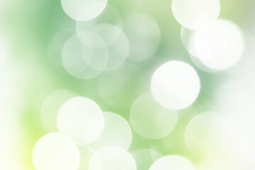 Fototapeta premium Summer green sparkling glitter bokeh background, abstract defocused lights texture