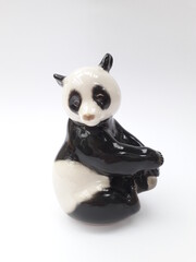 Cute panda bear porcelain statue isolated
