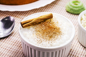 Mugunzá or Canjica, typical sweet from Brazil, made from lightly crushed white or yellow corn kernels, cooked in a broth containing coconut or cow milk, sugar, cinnamon powder or bark and cloves