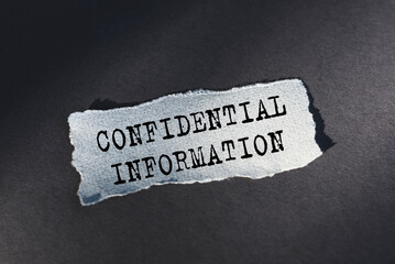 Business concept. A white wrinkled sheet of paper with text confidential information on black background