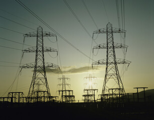 Silhouette of electricity pylons