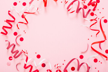 birthday background with red serpentine on pink