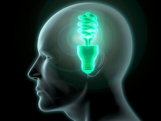 Close-up of a man's head with a glowing CFL green light bulb inside