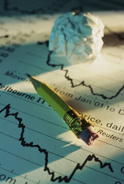 Close-up of a pencil on stock listings
