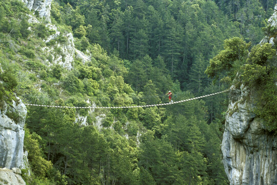 Person crossing a footbridge, France