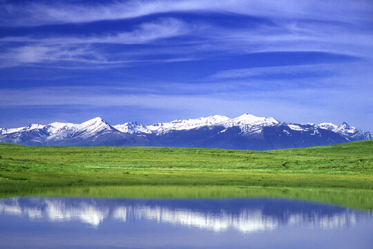 Reflection of snowcapped mountain in water, Wallowa Mountains, Oregon, USA