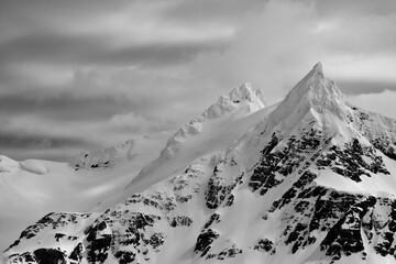 Clouds over a snow covered mountain, South Georgia Island, South Sandwich Islands