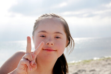 Portrait of little girl smiling on the background of the sea
