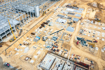 Factory Building. Aerial Industrial Construction Site with Crane and Construction Equipment.