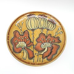 Mid-century modern wall plate with poppy flowers and cocoons