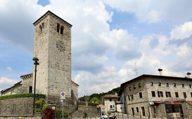 Fototapeta na wymiar A square and an ancient church in Nimis, municipality of the autonomous region of Friuli in Italy