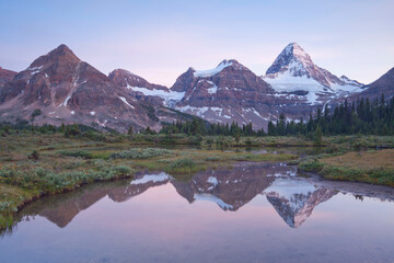 Canada, Mount Assiniboine Provincial Park, Magog meadows, Mount Assiniboine reflection in tarn at sunset