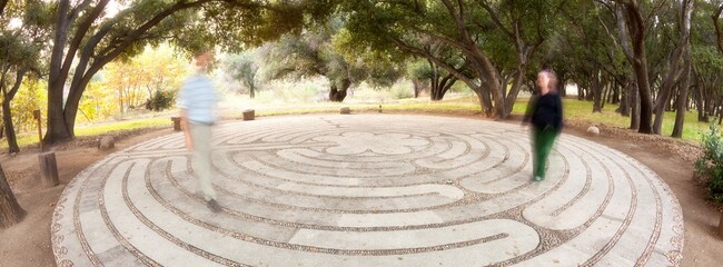 Mexico, Tecate, Rancho La Purerta, Man and woman walking in labyrinth