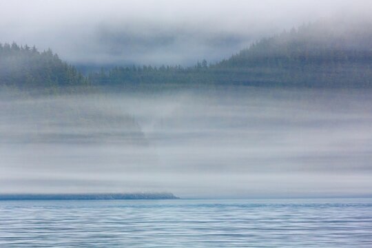 Fog over island, Inian Island, Elfin Cove, Alaska, USA