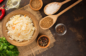 Sauerkraut with carrots in a bowl. Fermented food. Homemade food. Pickled food. Pickled vegetables. Vegetarian vegan food. View from above .