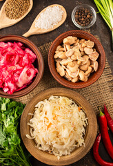 Pickled mushrooms, sauerkraut, cabbage salad with beets on the table.Fermented food. Homemade food. Pickled vegetables. Top view, flat lay. Copy space. Culinary background.