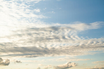 Cumulus clouds. White clouds on a blue background.