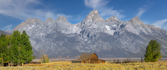 Historic Mormon barn in front of Teton mountain range in Grand Teton national park. © SNEHIT PHOTO