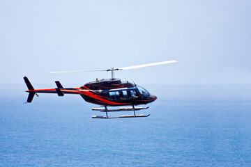 Side view of flying helicopter