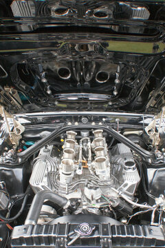 Racing car engine under the open hood