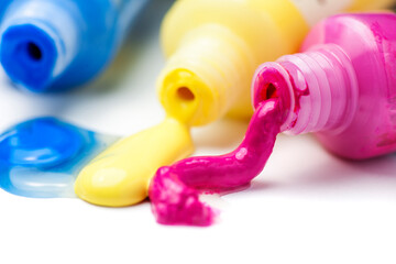 Close-up of three tubes of paint