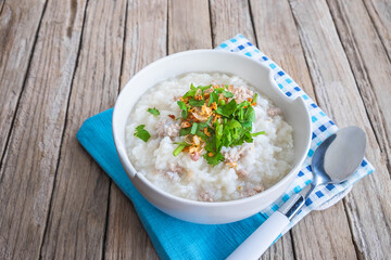 Breakfast rice porridge on a wooden table