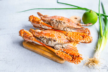 Seafood steamed crab on a white wood background