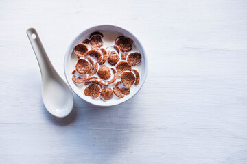 .Breakfast cereal with fresh milk on the white table