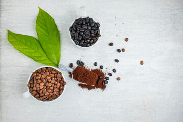 Coffee powder and coffee beans on the white table