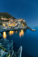 Sunset over the sea at Manarola, Cinque Terre, Italy.