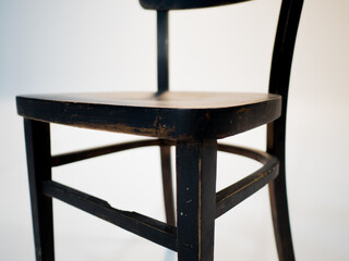 Wooden black antique chair on a white cyclorama