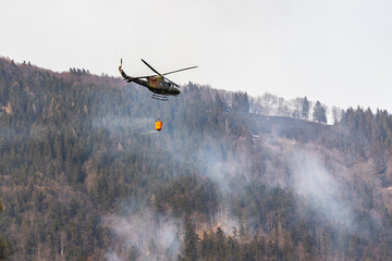 Fototapeta na wymiar helicopter in flight putting out fire