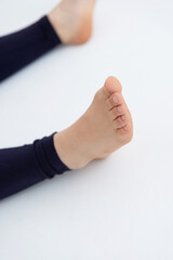 Obraz premium Sporty young woman doing relaxing yoga practice isolated on white background. Concept of healthy life and natural balance between body and mental development. Full length