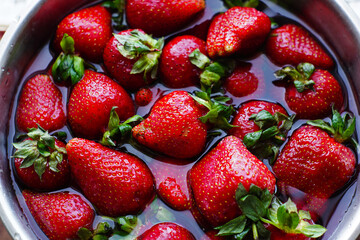 strawberries in a bowl in water © Roman Sverediuk