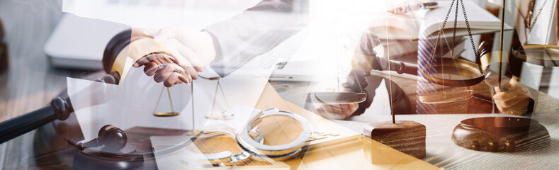 Business and lawyers discussing contract papers with brass scale on desk in office. Law, legal services, advice, justice and law concept picture with film grain effect