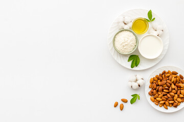 Almond products - oil milk flour with nuts. Organic food and cosmetic background