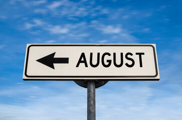 August road sign, arrow on blue sky background. One way blank road sign with copy space. Arrow on a...
