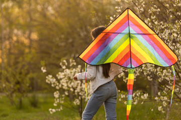 little girl with a kite in the spring. Childhood, Children's Day